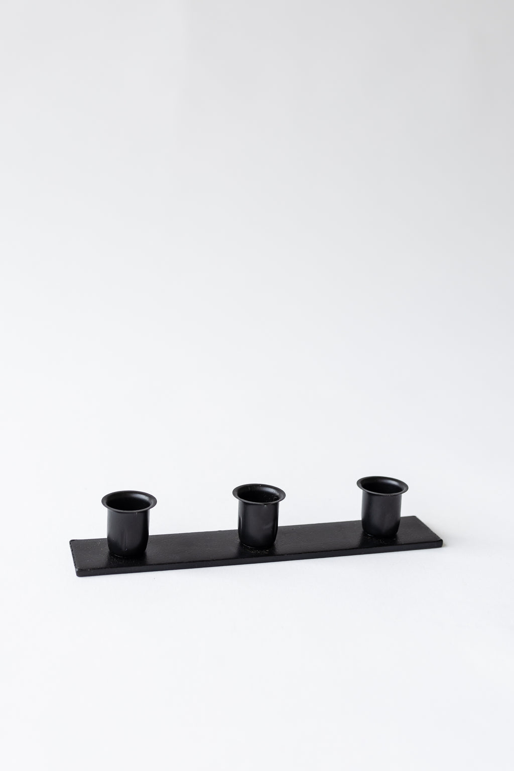 The Triple Candlestick Holder