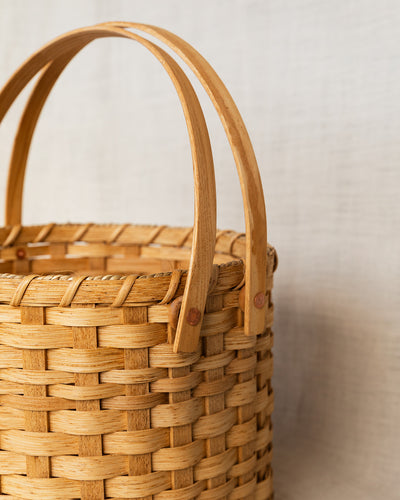 The Round Carrying Basket with Wooden Handles