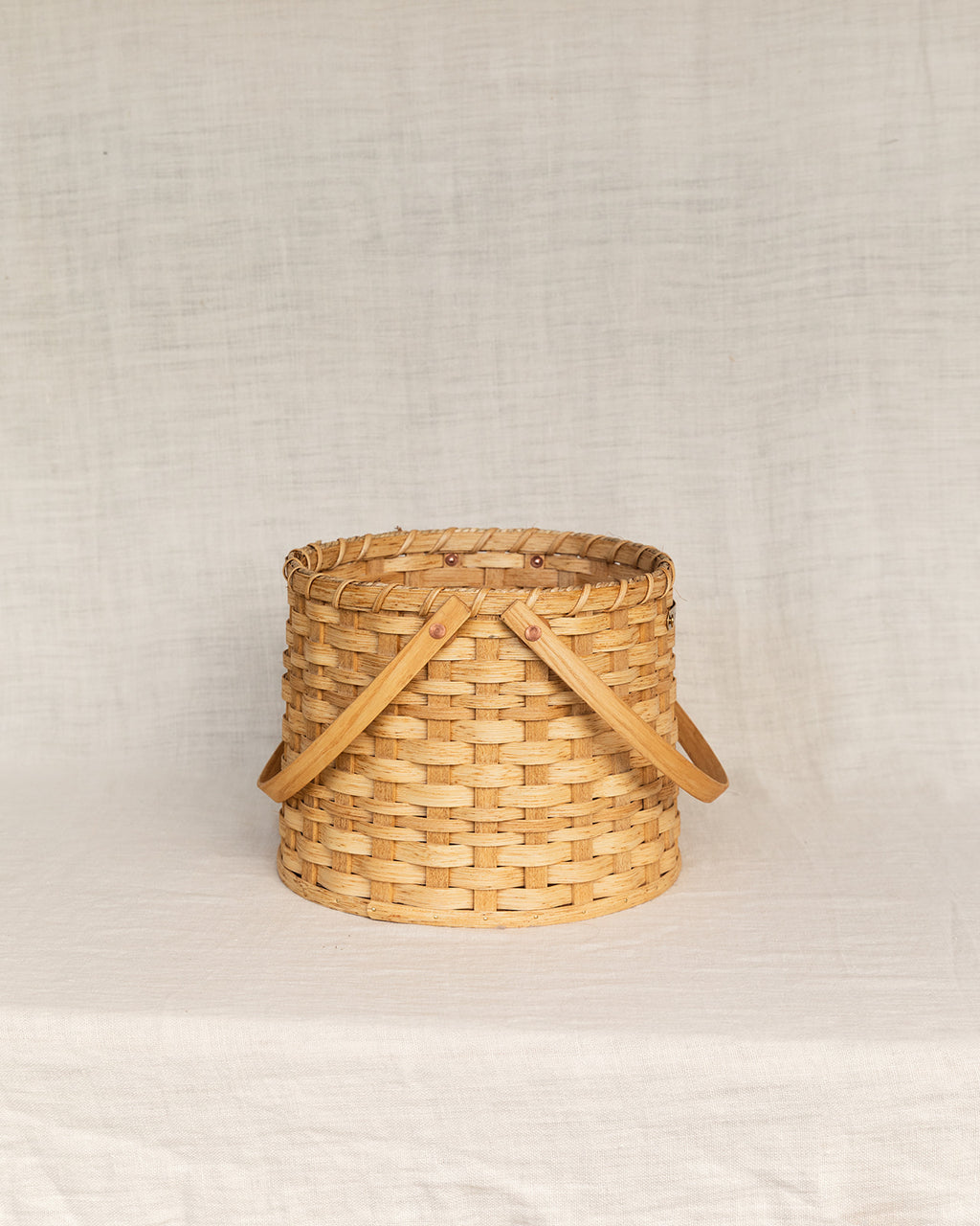 The Round Carrying Basket with Wooden Handles