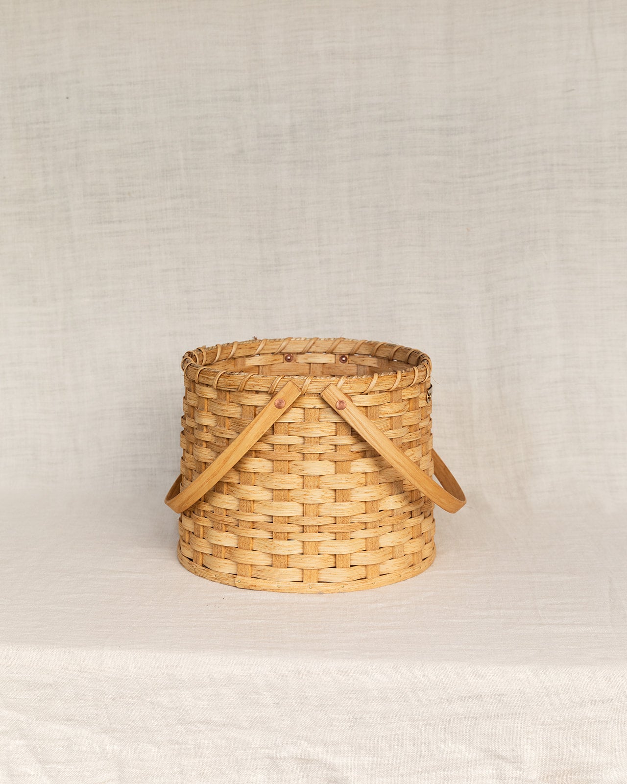 The Round Carrying Basket with Wooden Handles
