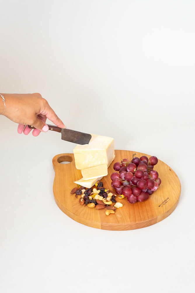 The Cherry Handcrafted Round Cutting Board with Cheese, Grapes, and Nuts 