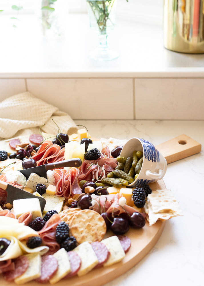 Round Serving Board with Food Displayed on it