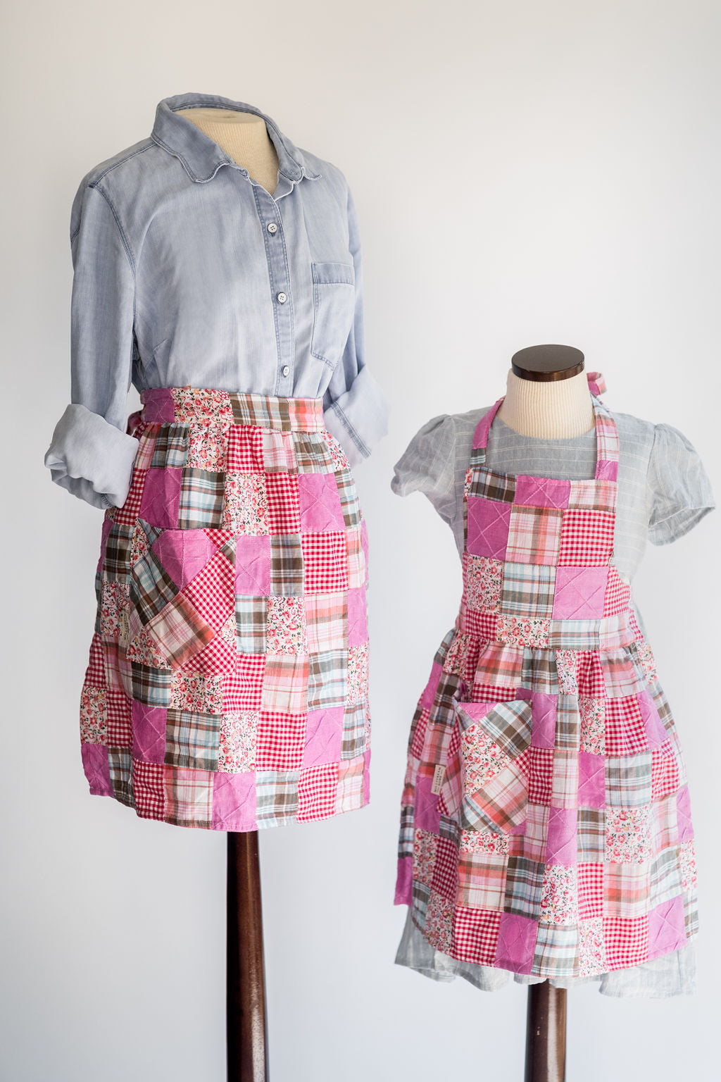 The Child's Quilted Patchwork Apron on a Mannequin