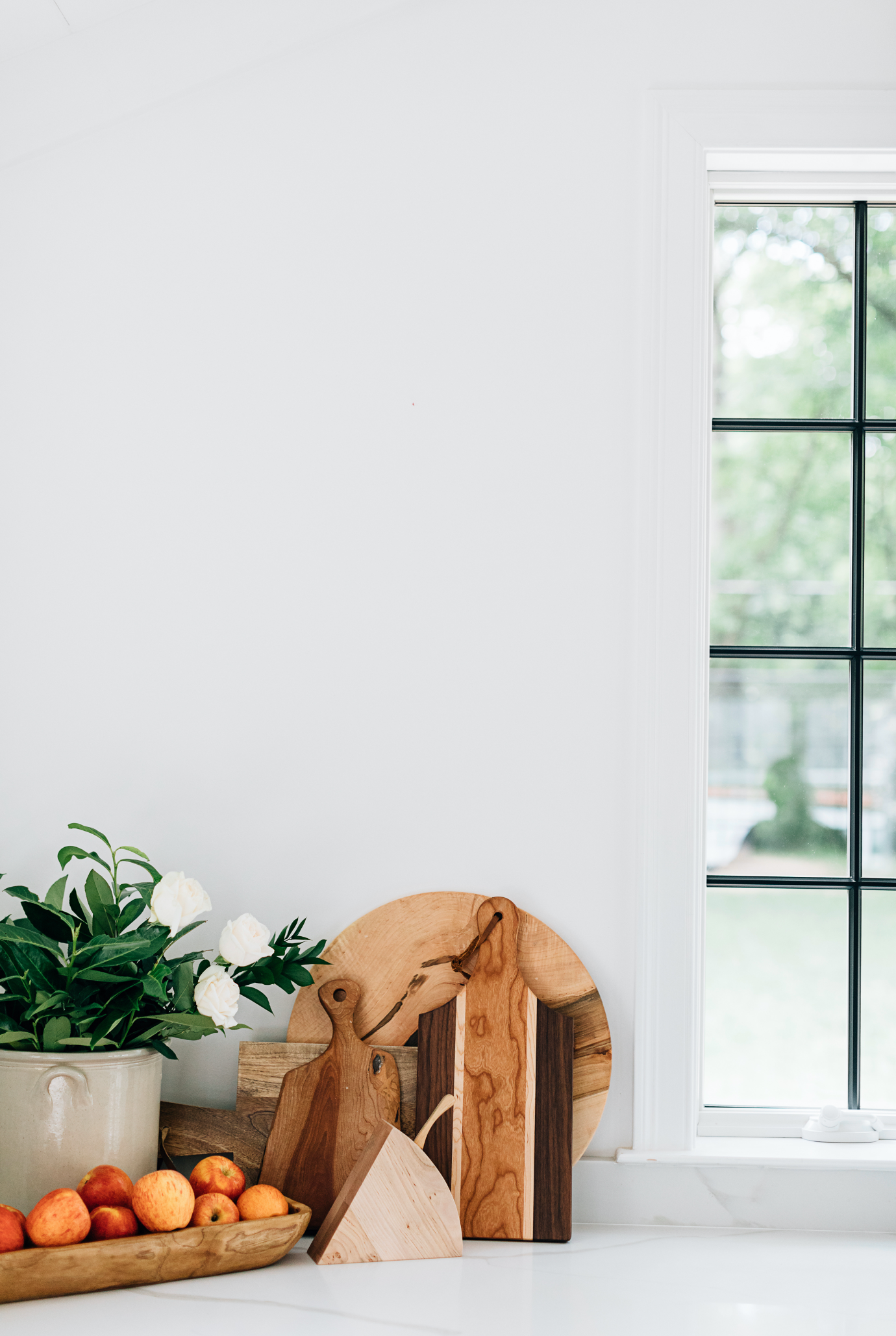 The Triple Wood Cheese Board on a Countertop