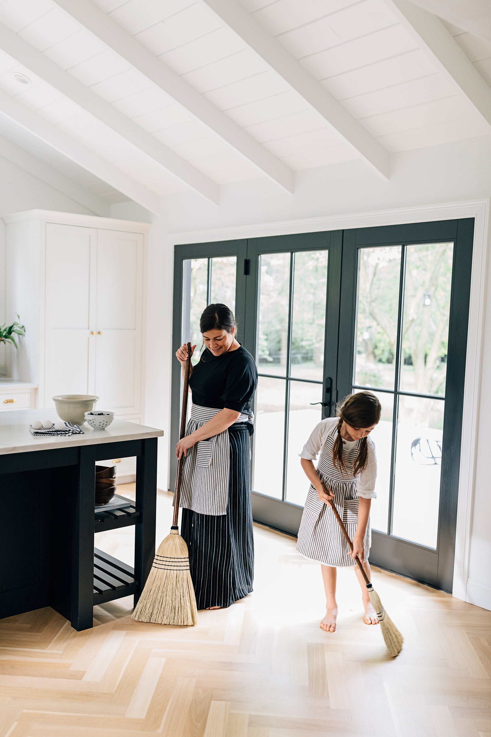 Adult and Child Sweeping with Millstream Home Brooms